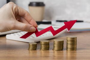 Hand Holding Growth Arrow With Coins